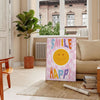 Abstract space scene with gray and brown tones, featuring motivational text - in a Parisian living room with a sofa and a fig plant