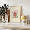 Abstract design featuring green and orange hues with motivational text - styled on a counter with eucalyptus and a bowl of lemons