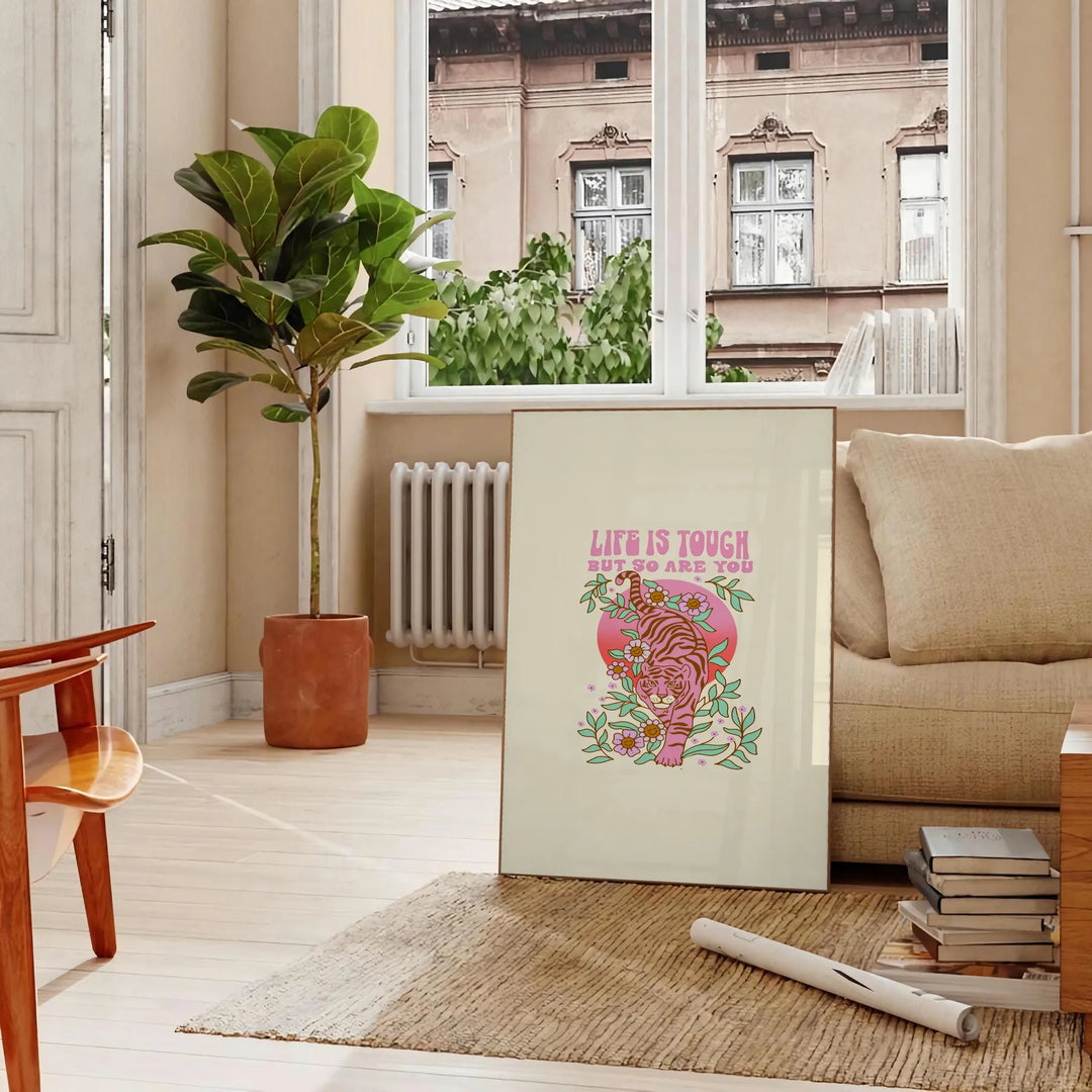 Abstract design featuring green and orange hues with motivational text - in a Parisian living room with a sofa and a fig plant
