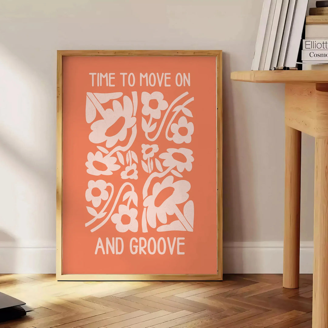 Abstract design with warm orange and brown tones promoting motivation - beside a round wooden side table with books