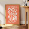 Abstract design with warm orange and brown tones promoting motivation - beside a round wooden side table with books