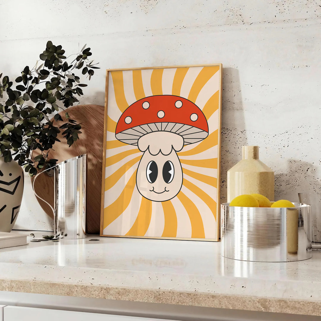 Retro-style poster featuring colorful mushrooms on a yellow background - styled on a counter with eucalyptus and a bowl of lemons