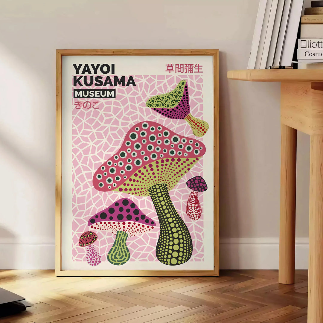 Colorful mushrooms in Yayoi Kusama's signature polka dot style - beside a round wooden side table with books