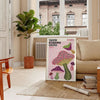 Colorful mushrooms in Yayoi Kusama's signature polka dot style - in a Parisian living room with a sofa and a fig plant