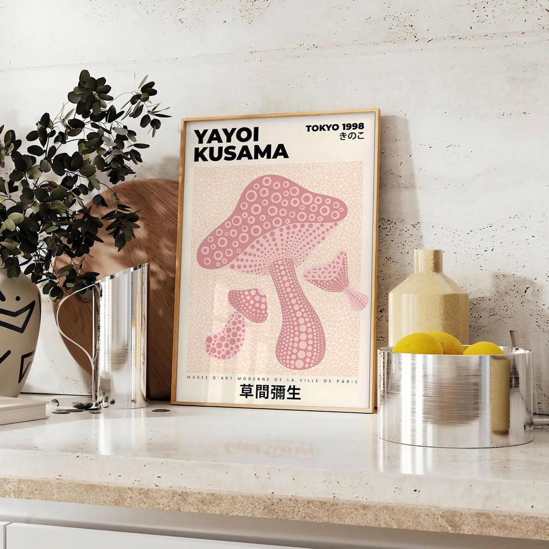 Colorful mushrooms in a whimsical style by Yayoi Kusama - styled on a counter with eucalyptus and a bowl of lemons