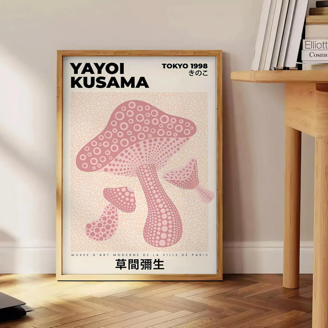 Colorful mushrooms in a whimsical style by Yayoi Kusama - beside a round wooden side table with books