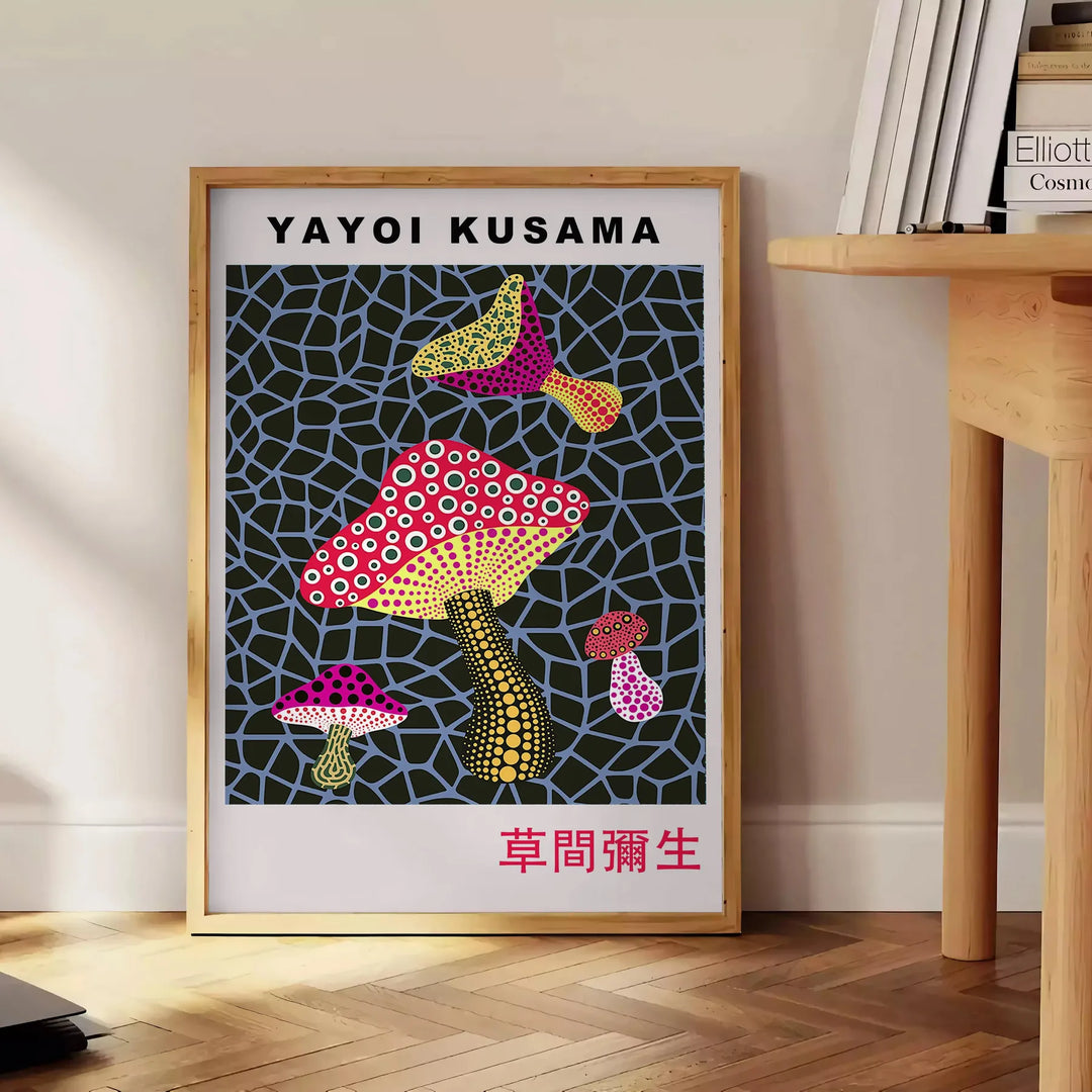 Colorful mushroom pattern with polka dots by Yayoi Kusama - beside a round wooden side table with books