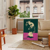 Graphic art print featuring a stylized phone with green and red hues - in a Parisian living room with a sofa and a fig plant