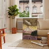A serene landscape of a national park in gray and black tones - in a Parisian living room with a sofa and a fig plant