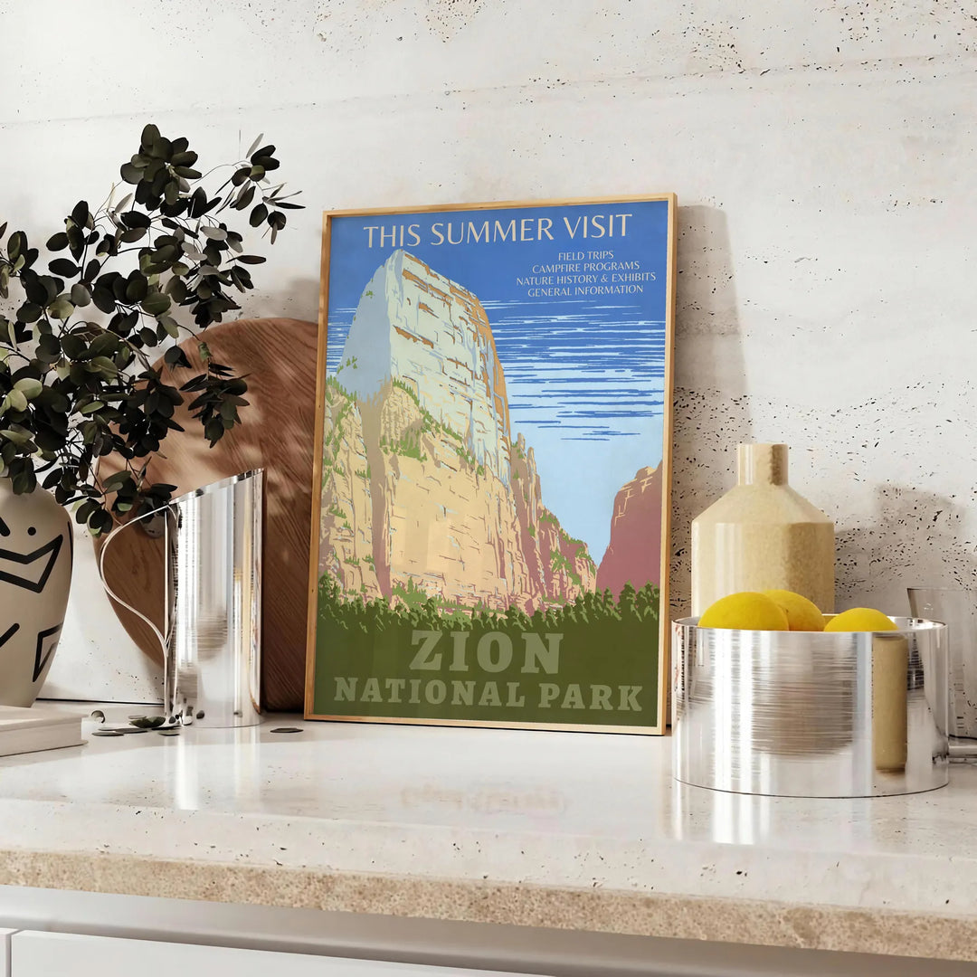 A serene landscape featuring lush green trees and earthy brown mountains in a national park. - styled on a counter with eucalyptus and a bowl of lemons