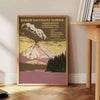 Illustration of a national park with mountains and trees in muted colors - beside a round wooden side table with books