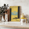 Illustration of national parks with lush greenery and sunny yellow accents - styled on a counter with eucalyptus and a bowl of lemons
