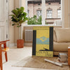 Illustration of national parks with lush greenery and sunny yellow accents - in a Parisian living room with a sofa and a fig plant