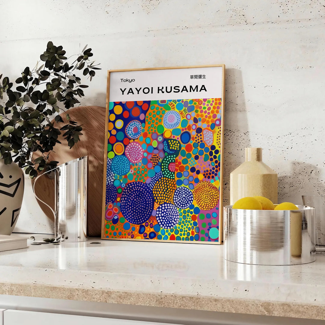 Abstract nature scene in Yayoi Kusama's iconic polka dot style with blue and earthy tones - styled on a counter with eucalyptus and a bowl of lemons