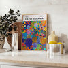 Abstract nature scene in Yayoi Kusama's iconic polka dot style with blue and earthy tones - styled on a counter with eucalyptus and a bowl of lemons
