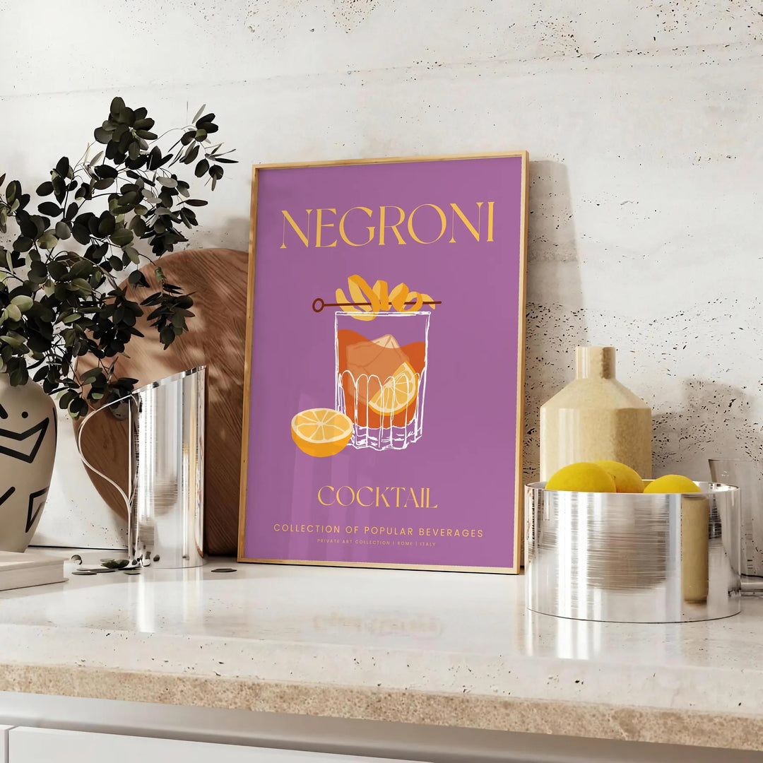 Illustration of a Negroni cocktail with orange and yellow hues - styled on a counter with eucalyptus and a bowl of lemons