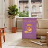 Illustration of a Negroni cocktail with orange and yellow hues - in a Parisian living room with a sofa and a fig plant