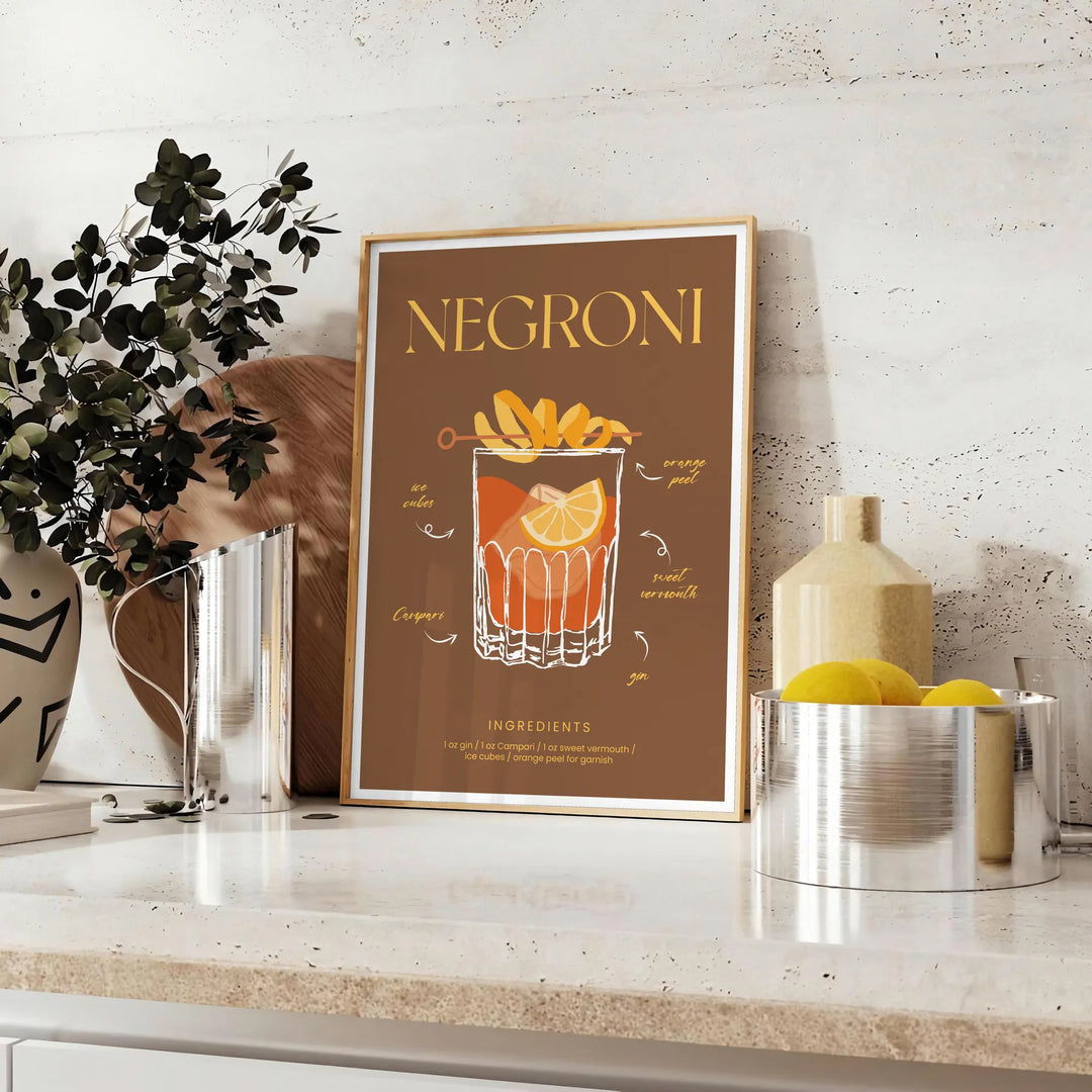 Illustration of a Negroni cocktail with orange and green hues - styled on a counter with eucalyptus and a bowl of lemons