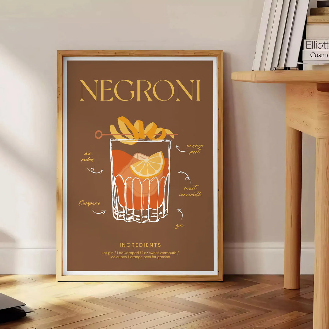 Illustration of a Negroni cocktail with orange and green hues - beside a round wooden side table with books