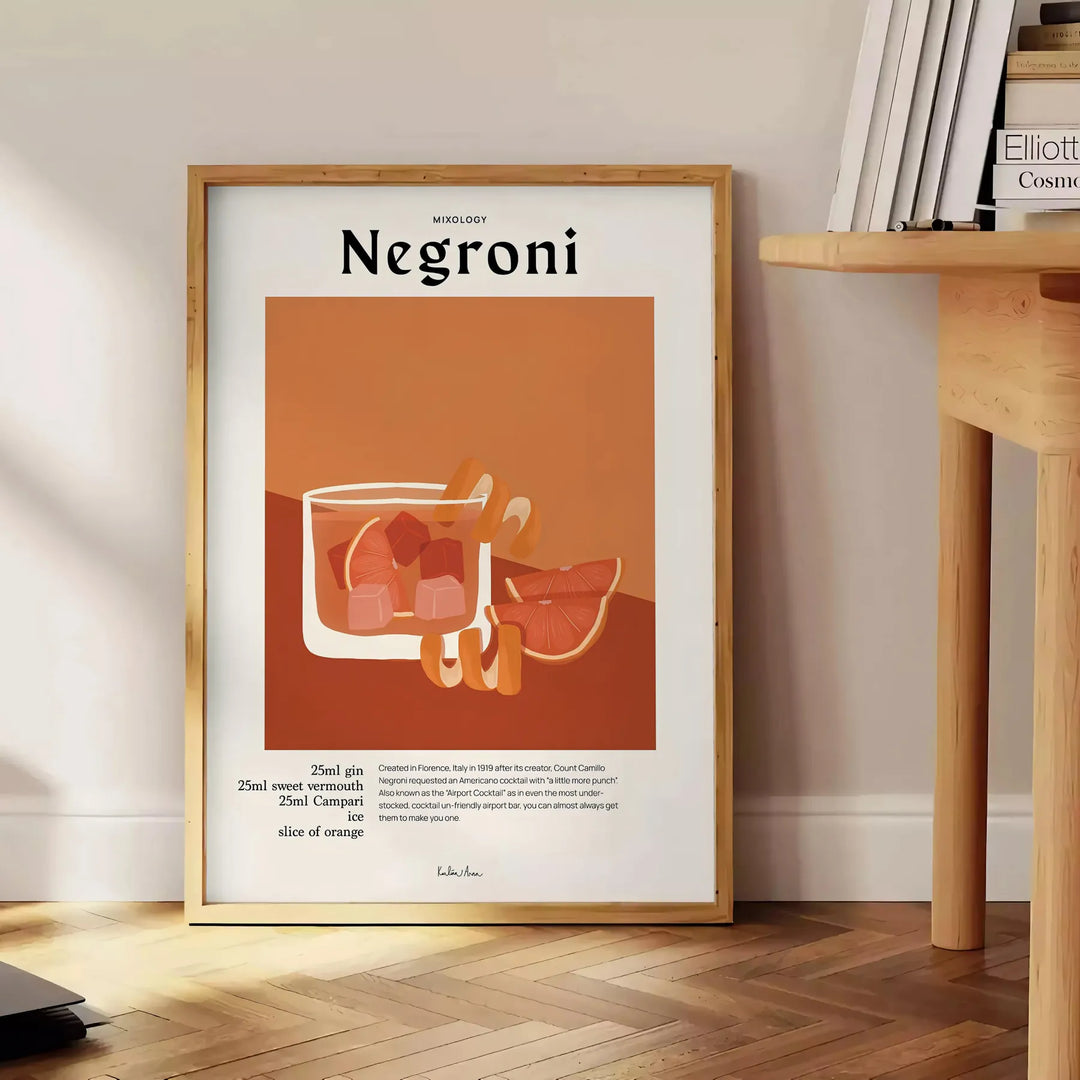 Illustration of a Negroni cocktail in orange and black tones - beside a round wooden side table with books