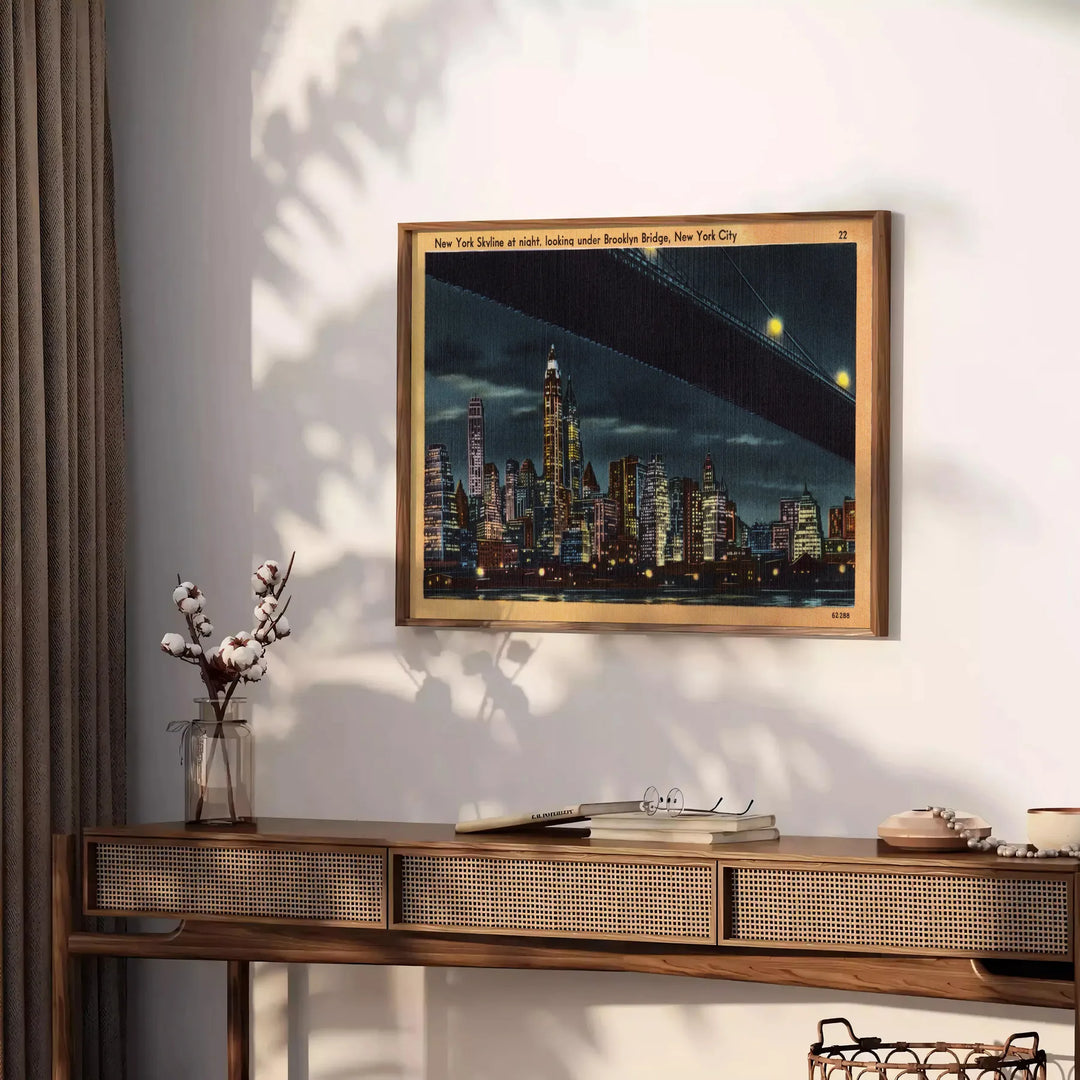 A vintage-style travel poster featuring New York City skyline in black and green hues - styled on a counter with eucalyptus and a bowl of lemons