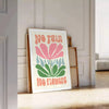 Colorful flowers in a groovy style with brown and green tones - leaning on a herringbone floor against a white panelled wall