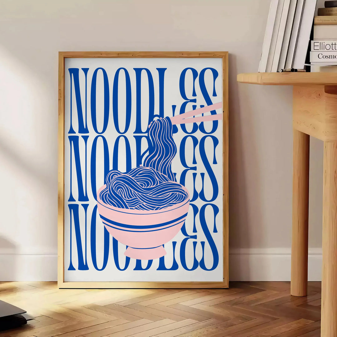 A minimalist poster featuring a bowl of noodles in gray and green tones - beside a round wooden side table with books