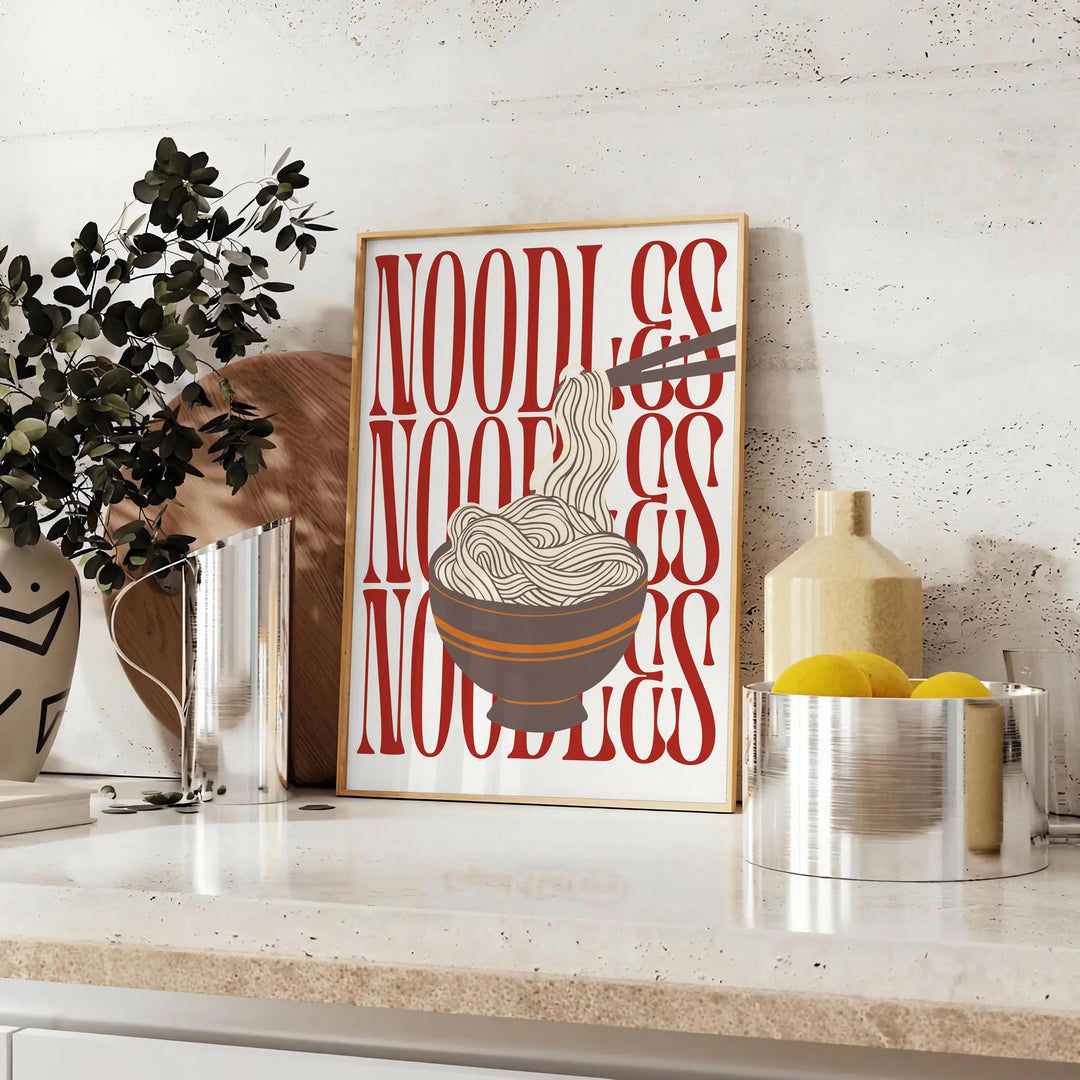 A minimalist kitchen scene featuring a bowl of noodles on a gray background - styled on a counter with eucalyptus and a bowl of lemons