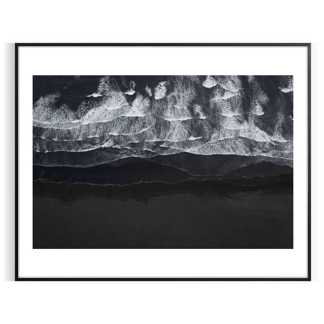 A tranquil ocean scene with soft green and blue hues - in a black frame