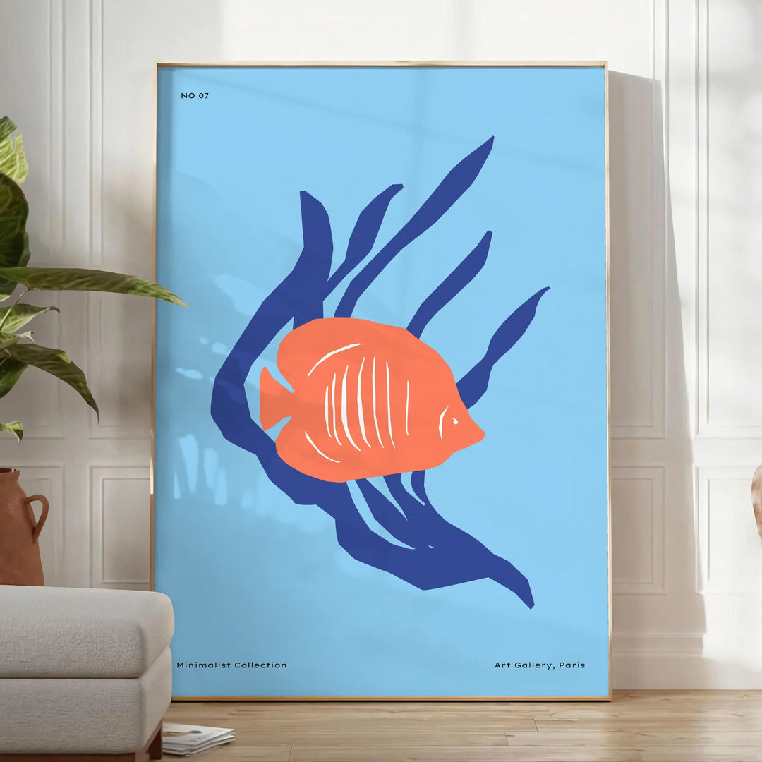 A colorful depiction of ocean wildlife featuring orange and blue hues - in a bright minimalist room with a plant and an armchair