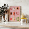 Graphic print of assorted fruits in bold black and brown tones - styled on a counter with eucalyptus and a bowl of lemons