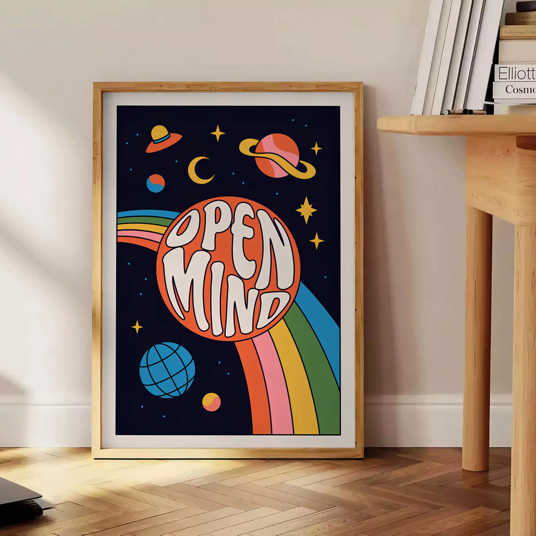 Abstract design featuring swirling orange and black shapes with a retro vibe - beside a round wooden side table with books