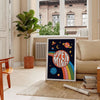 Abstract design featuring swirling orange and black shapes with a retro vibe - in a Parisian living room with a sofa and a fig plant