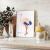 An abstract depiction of an ostrich with dynamic orange and blue hues - styled on a counter with eucalyptus and a bowl of lemons