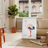 An abstract depiction of an ostrich with dynamic orange and blue hues - in a Parisian living room with a sofa and a fig plant