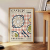 Illustration of oysters on a green and orange background - beside a round wooden side table with books