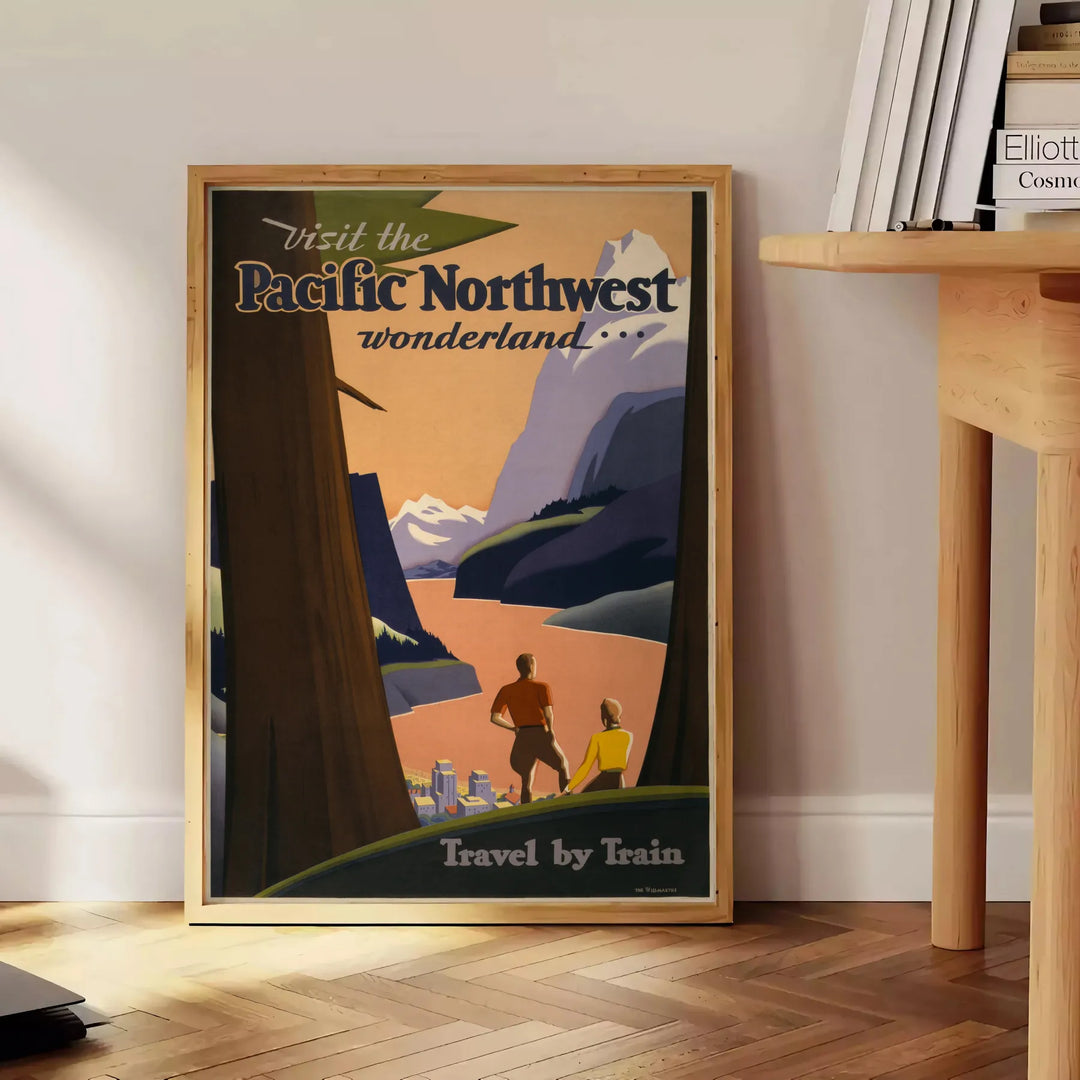 Illustration of the Pacific Northwest landscape with green forests and mountains - beside a round wooden side table with books