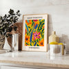Orange and white papercut art poster, minimalist layered paper design - styled on a counter with eucalyptus and a bowl of lemons