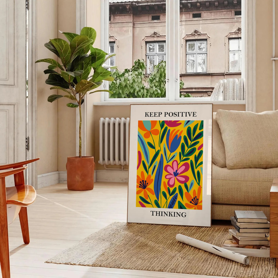 Orange and white papercut art poster, minimalist layered paper design - in a Parisian living room with a sofa and a fig plant