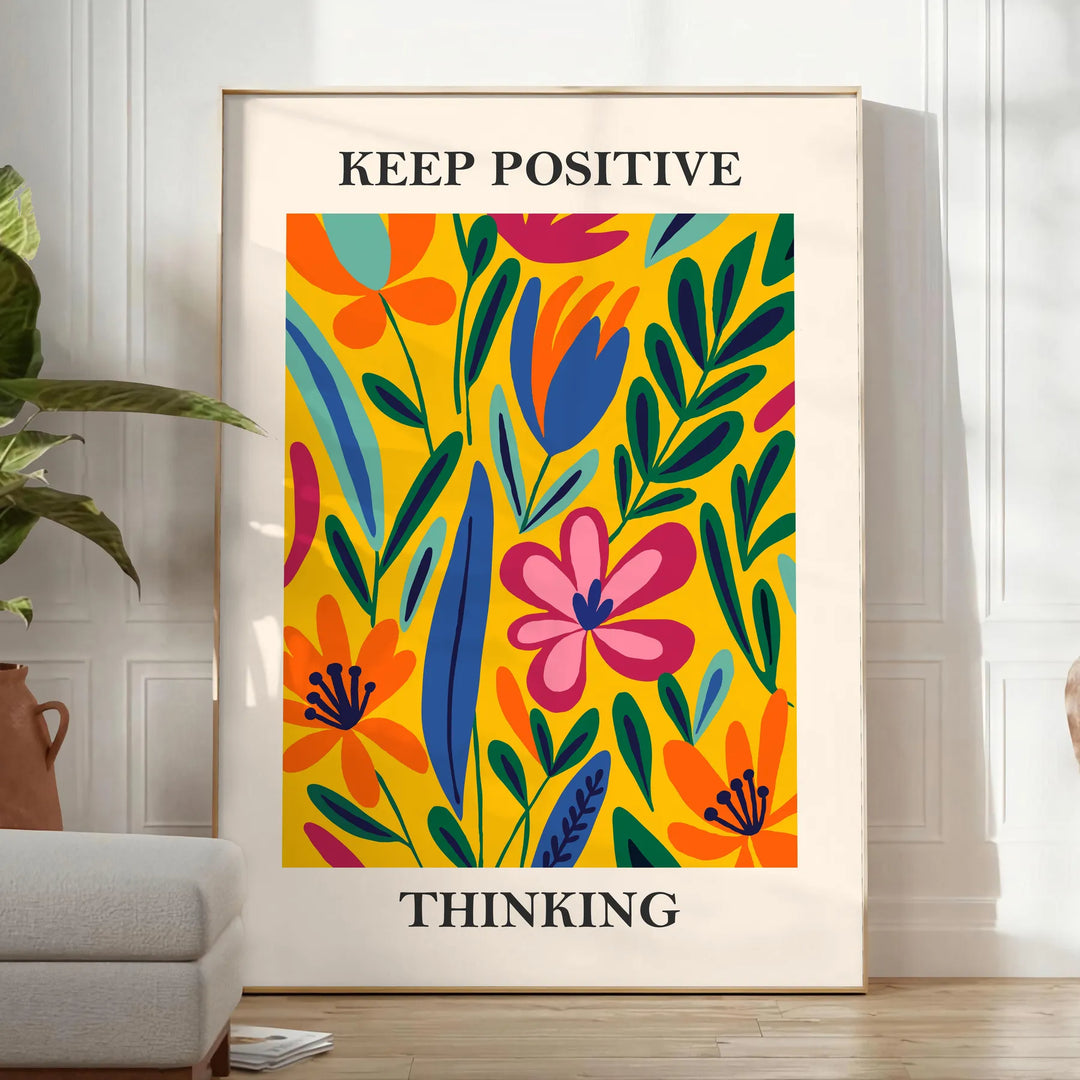 Orange and white papercut art poster, minimalist layered paper design - in a bright minimalist room with a plant and an armchair