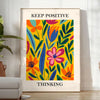 Orange and white papercut art poster, minimalist layered paper design - in a bright minimalist room with a plant and an armchair