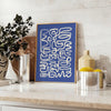 Abstract gray and white paper-cut design with minimalist shapes - styled on a counter with eucalyptus and a bowl of lemons