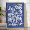 Abstract gray and white paper-cut design with minimalist shapes - in a bright minimalist room with a plant and an armchair