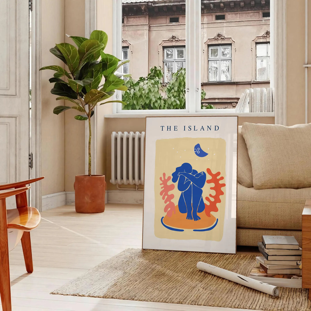 Papier découpé artwork featuring intricate cut-out designs in orange and blue - in a Parisian living room with a sofa and a fig plant