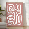 Minimalist paper-cut artwork in white and brown, layered abstract design - in a bright minimalist room with a plant and an armchair