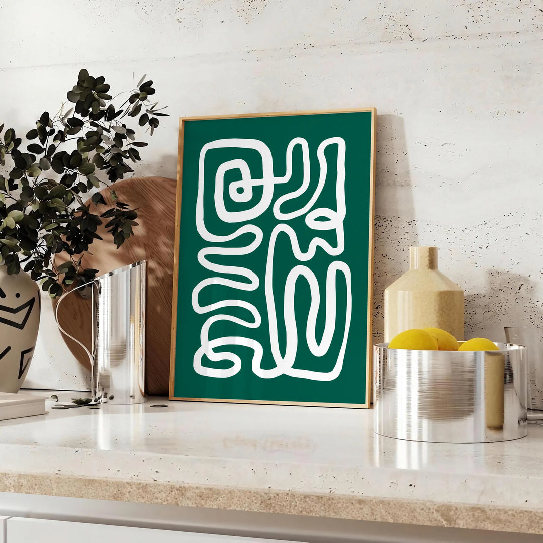 White and green paper-cut botanical artwork on minimalist poster - styled on a counter with eucalyptus and a bowl of lemons