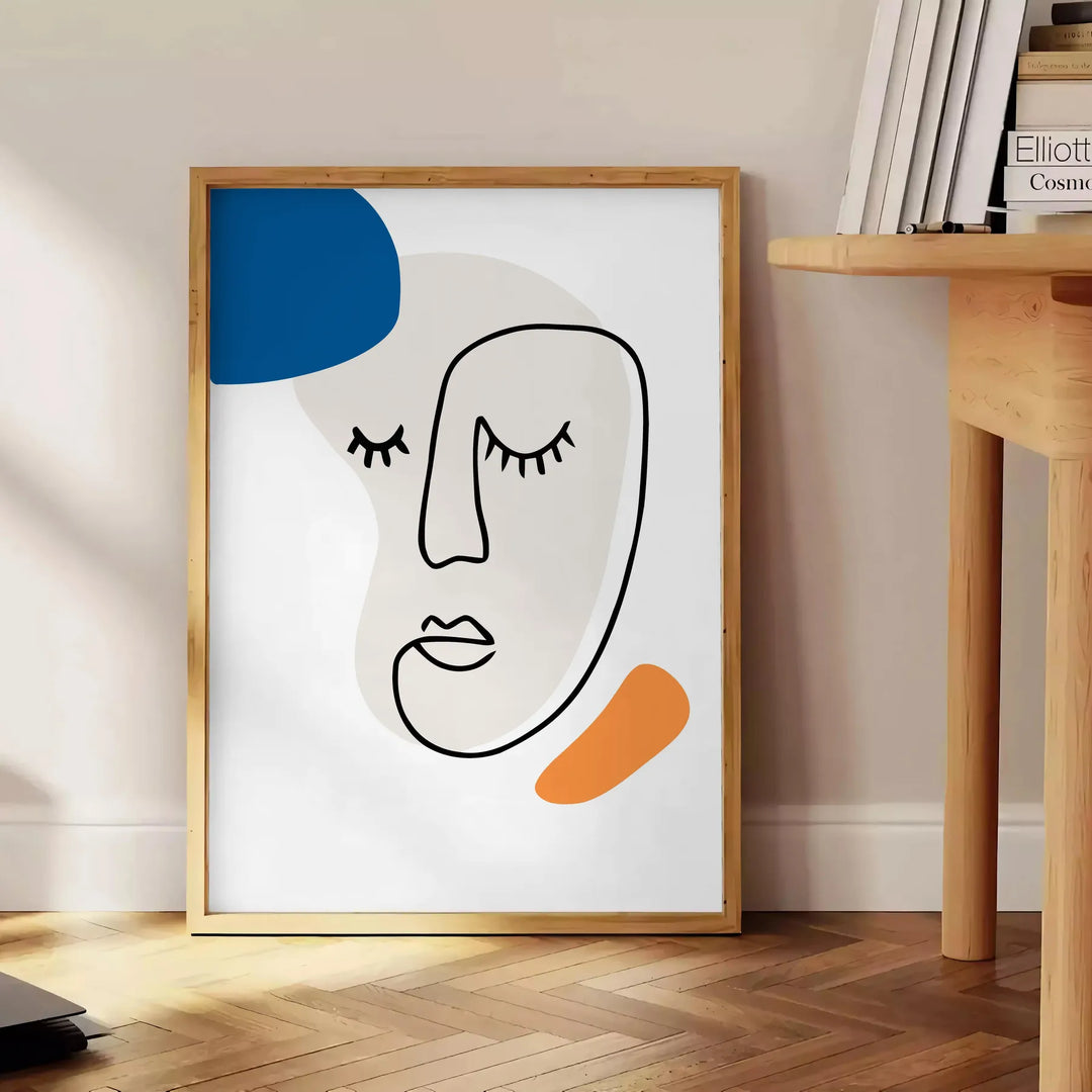 Paper-cut space collage poster in gray and white abstract design - beside a round wooden side table with books