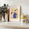 Abstract paper-cut design featuring layered orange and blue shapes - styled on a counter with eucalyptus and a bowl of lemons