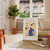 Abstract paper-cut design featuring layered orange and blue shapes - in a Parisian living room with a sofa and a fig plant