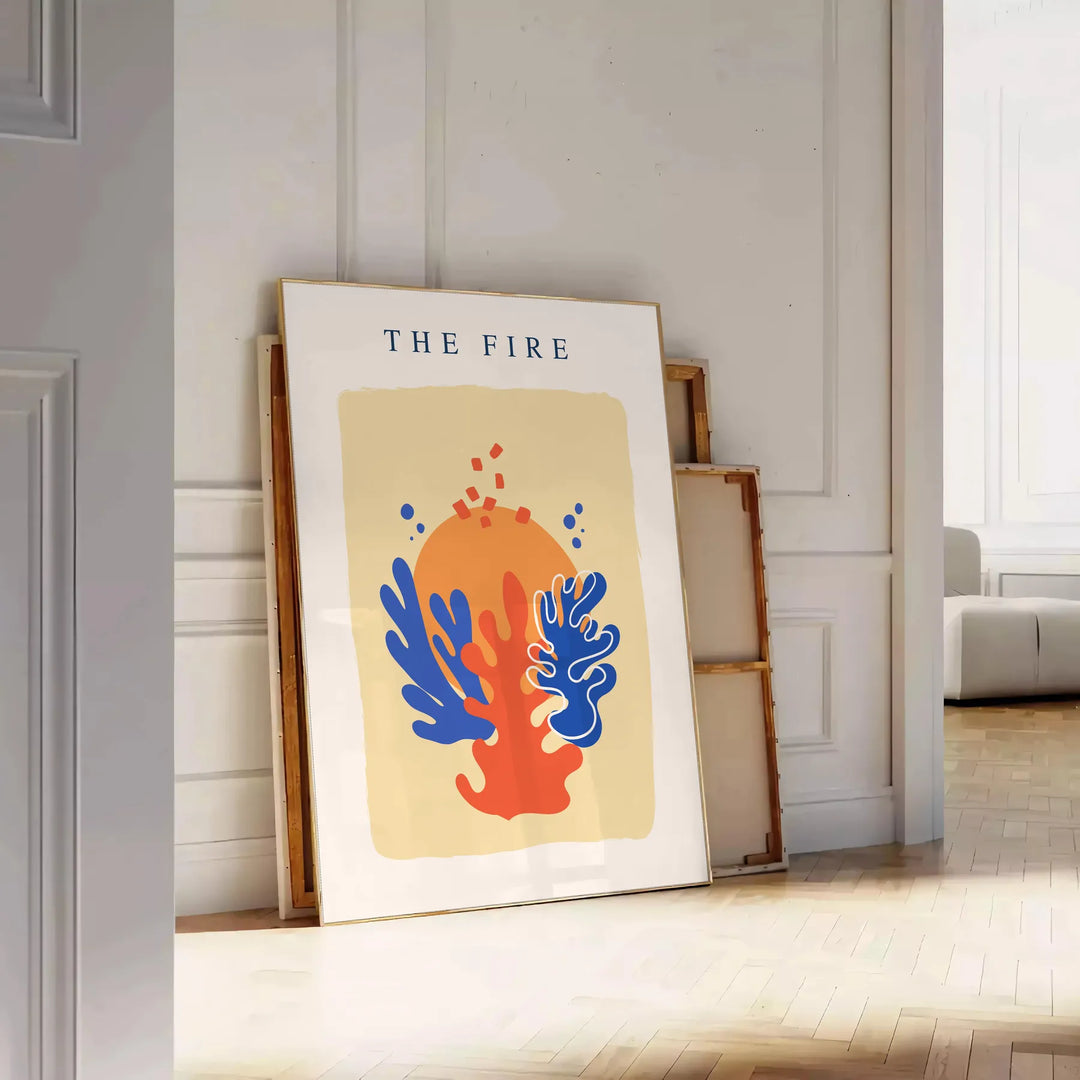 Abstract design featuring layered orange and blue paper-cut shapes - leaning on a herringbone floor against a white panelled wall